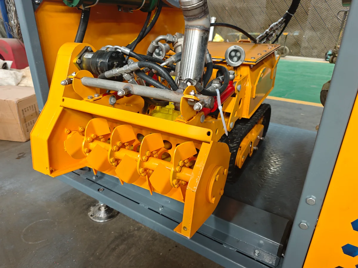 Yellow standard breaker head installed on a desilting robot